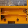 Photo d'une Game Boy Pocket Jaune, vue du compartiment à piles