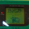 Photo d'une Game Boy Classic Verte, vue de l'écran qui fonctionne